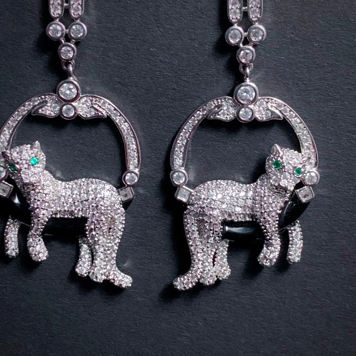 Lounging Leopard Earrings in Silver with Emerald Eyes